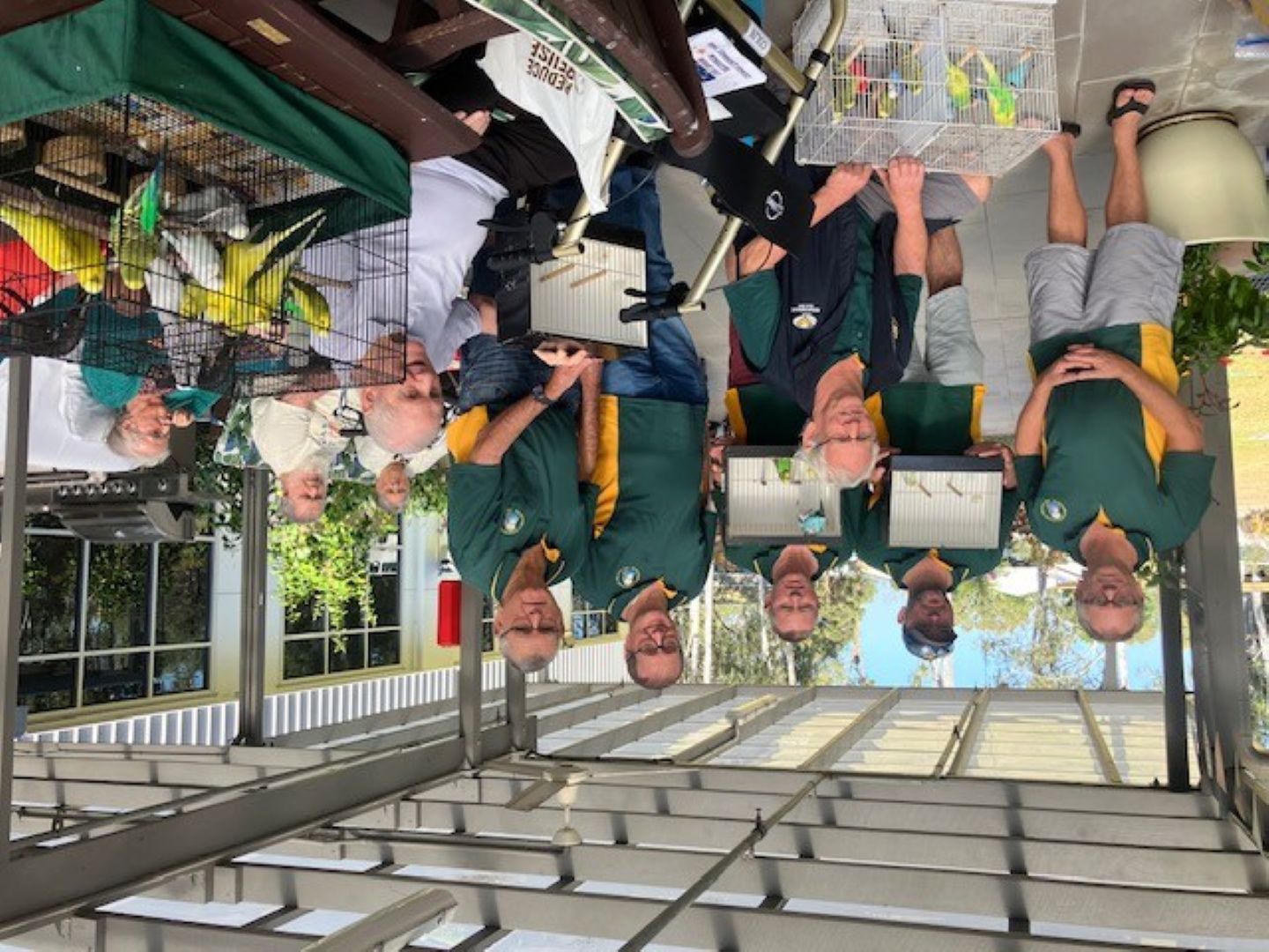 Club members presting birds to aged care residents